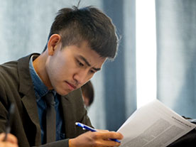 Student reviewing assistantship information