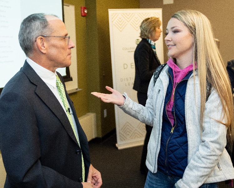 Attorney Ray Boucher speaks with a student.