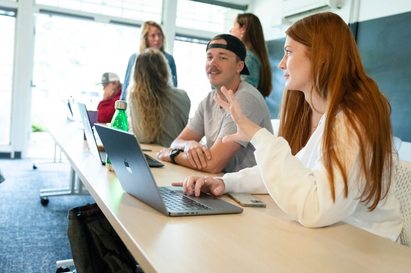 Students at a workshop in the lounge at Rockwell Hall North.