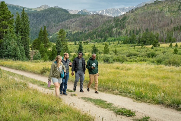 Impact MBA students walking along a trail
