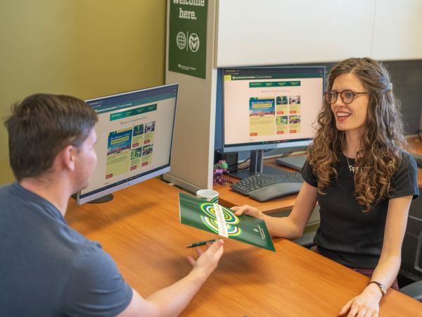 Career Management Center counselor Amy Kozlarek meets with a business student.