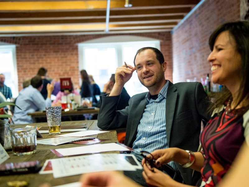 Evening MBA students discuss an assignment in class.