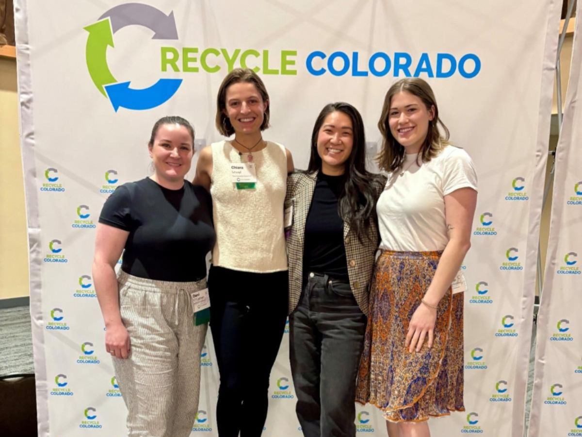 Impact MBA students pose for a photo at a Recycling Colorado event.