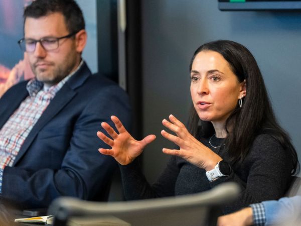Dr. Gina Slejko speaks during a group discussion in class.