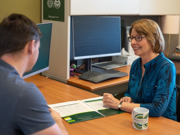 Career Management Center counselor Barbara Valusek meets with a business student.