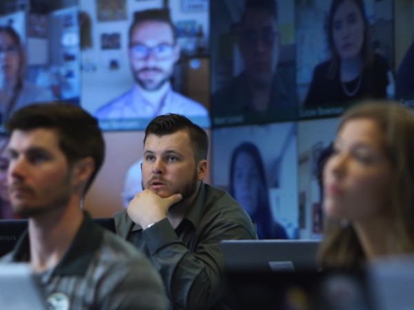 An MBA student watches a lecture in the Mosaic classroom.