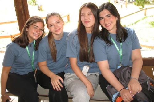 A group of young students pose for a photo during the Global Business Academy at the CSU College of Business.