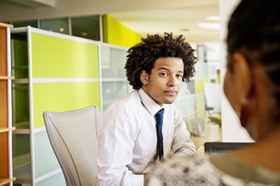 A business student sits for a mock interview