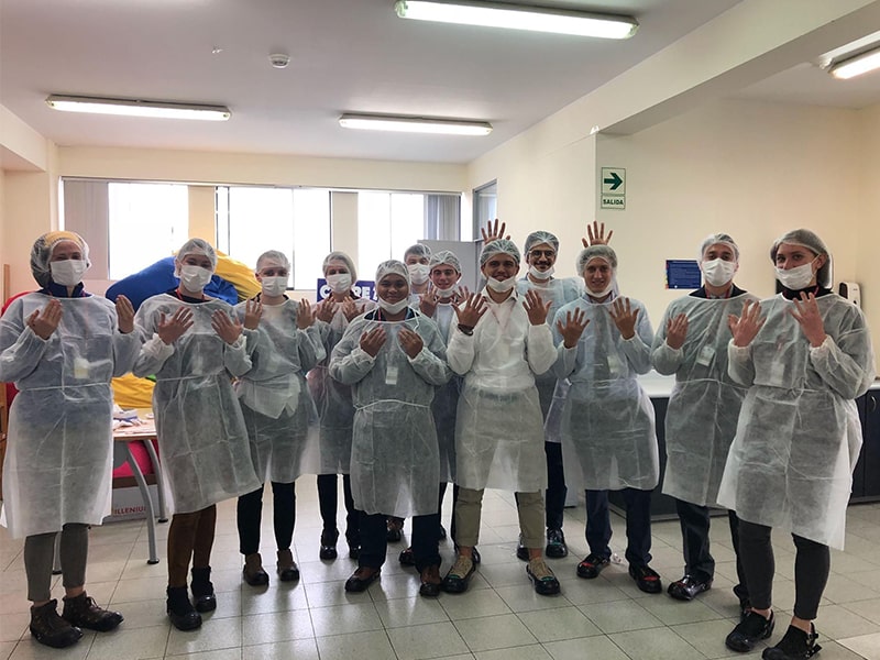 Supply chain students wearing medical garb