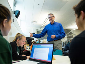 Business professor, Joe Cannon, chats with students