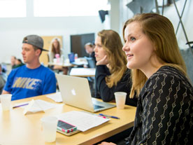 Business students listen during a lecture