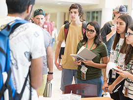 A group of students stand in the Lory Student Center