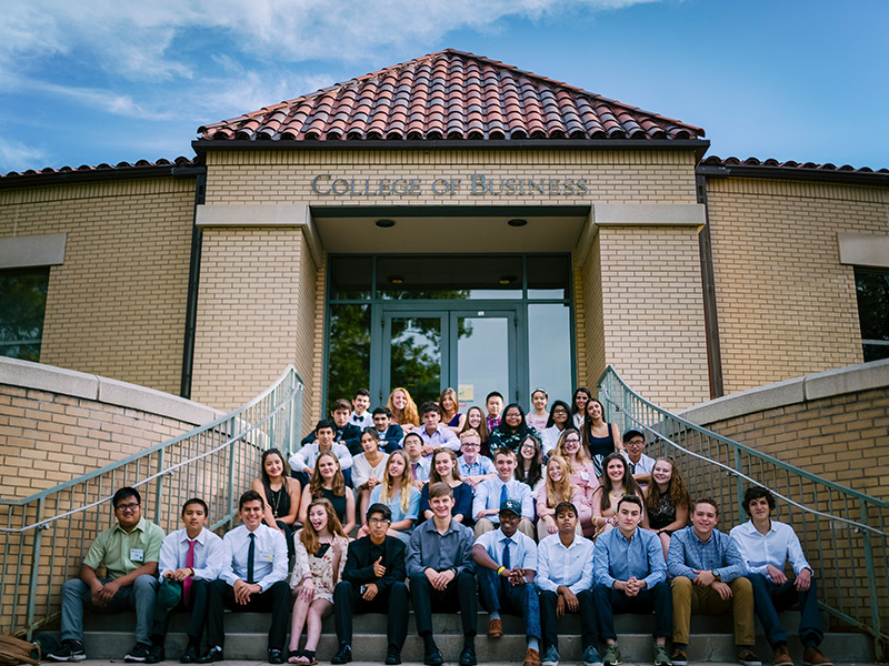 The students of Global Business Academy pose for a photo outside of Rockwell Hall