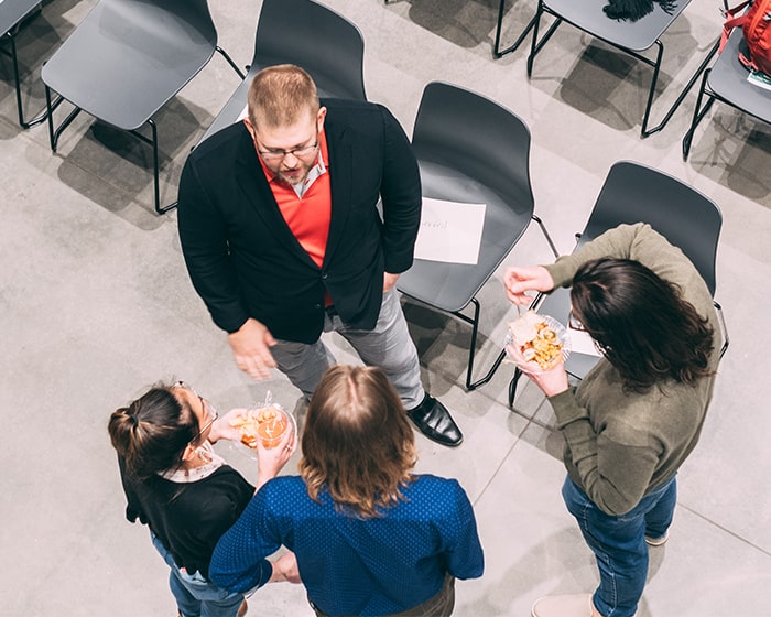 A Venture Validator instructor gives a thumbs up gesture to a participant.