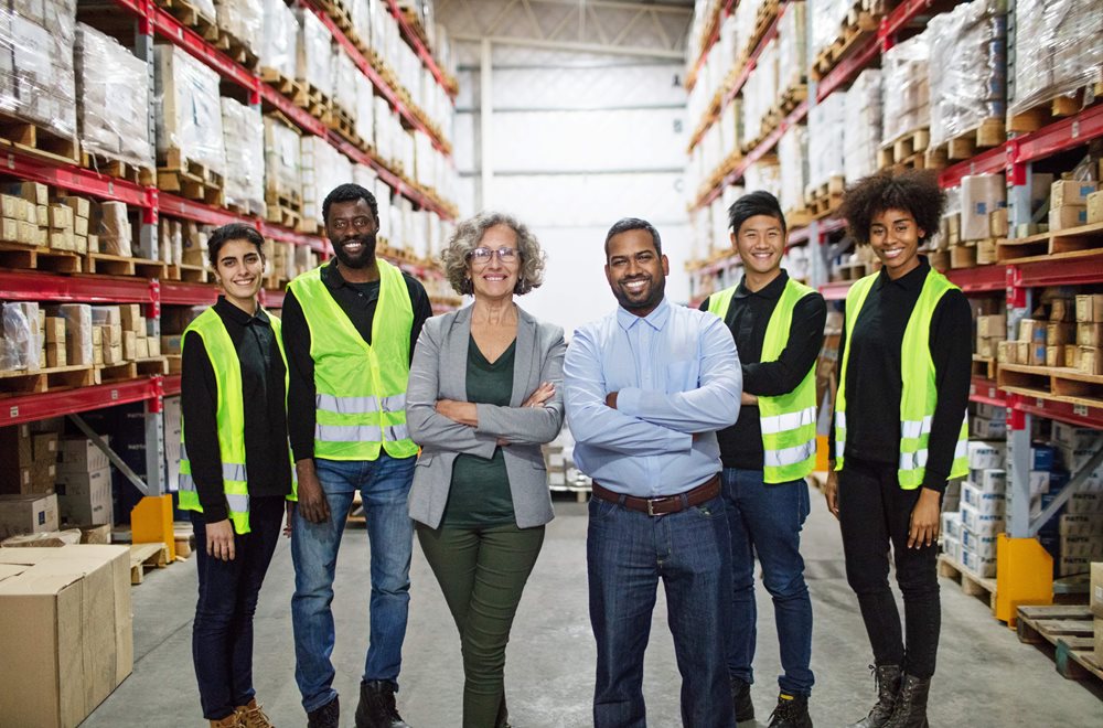 A group of workers in a warehouse
