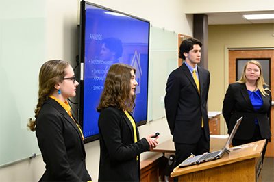 Students present at a case competition