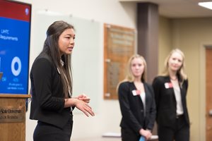 Students present at a case competition
