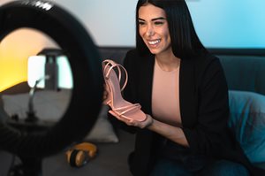 An influencer reviews a pair of shoes