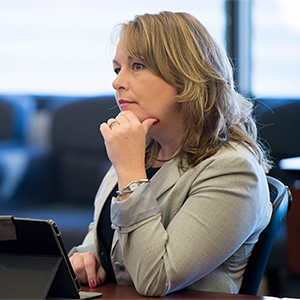 A woman with a thoughtful look on her face.