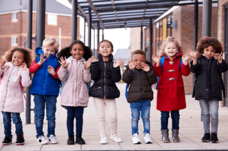 School kids outside wearing coats