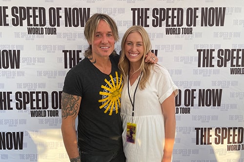 Megan Kleinschmidt and Keith Urban pose for a photo