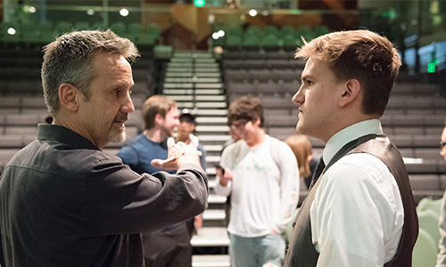 A group of business students works with a mentor