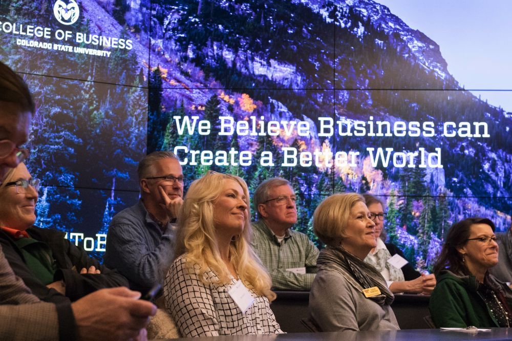 The Global Leadership Council listens to a speaker in the Mosaic classroom at the College of Business.
