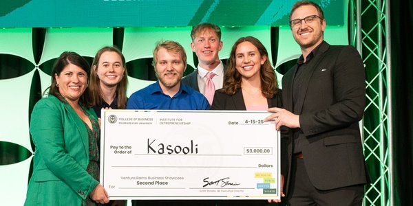 A team of students pose for a photo with Institute For Entrepreneurship staff after winning $3,000 for thier startup, Kasooli, at the 2025 Venture Rams Business Showcase.