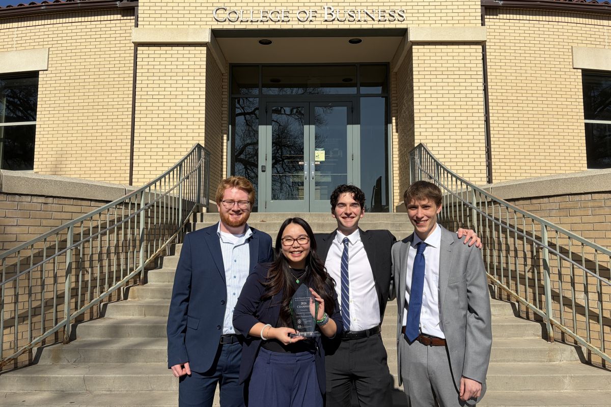 CSU supply chain students pose for a photo with a trophy for winning a case competition.