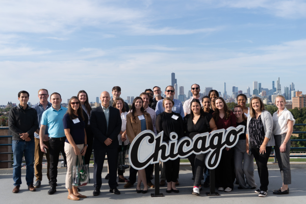 A group of MBA students pose for a photo in Chicago during a business immersion travel course.