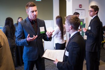 Employers talk to students during the College of Business career expo